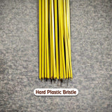 Hard bristle broom with plastic handle, close-up of bristles