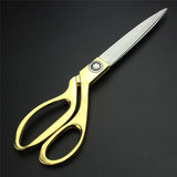 Gold-plated professional scissors for cutting cloth.